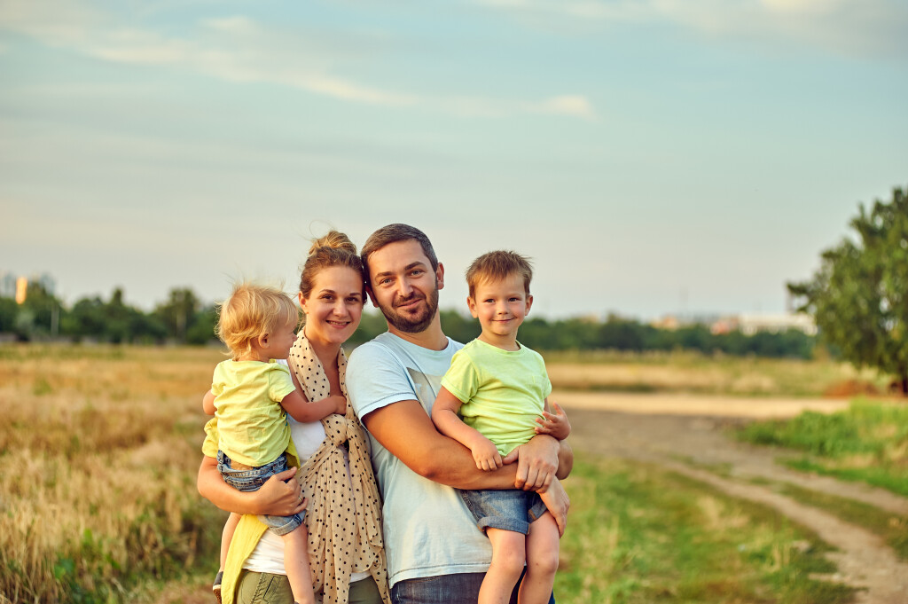 Young,Married,Couple,With,Children,On,A,Country,Walk